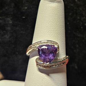 Genuine amethyst in diamond ring